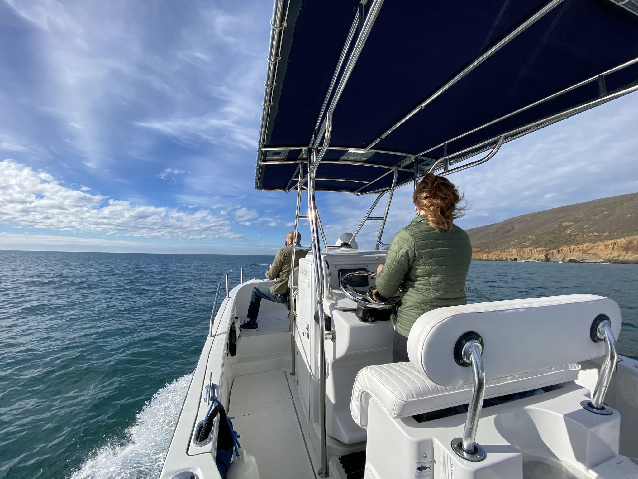 View from the deck of the catamaran underway along the coast